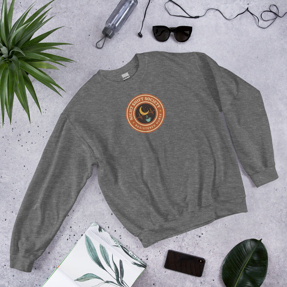 Night Shift Society retro registered nurse badge crewneck sweatshirt — Graphite Heather, front-right