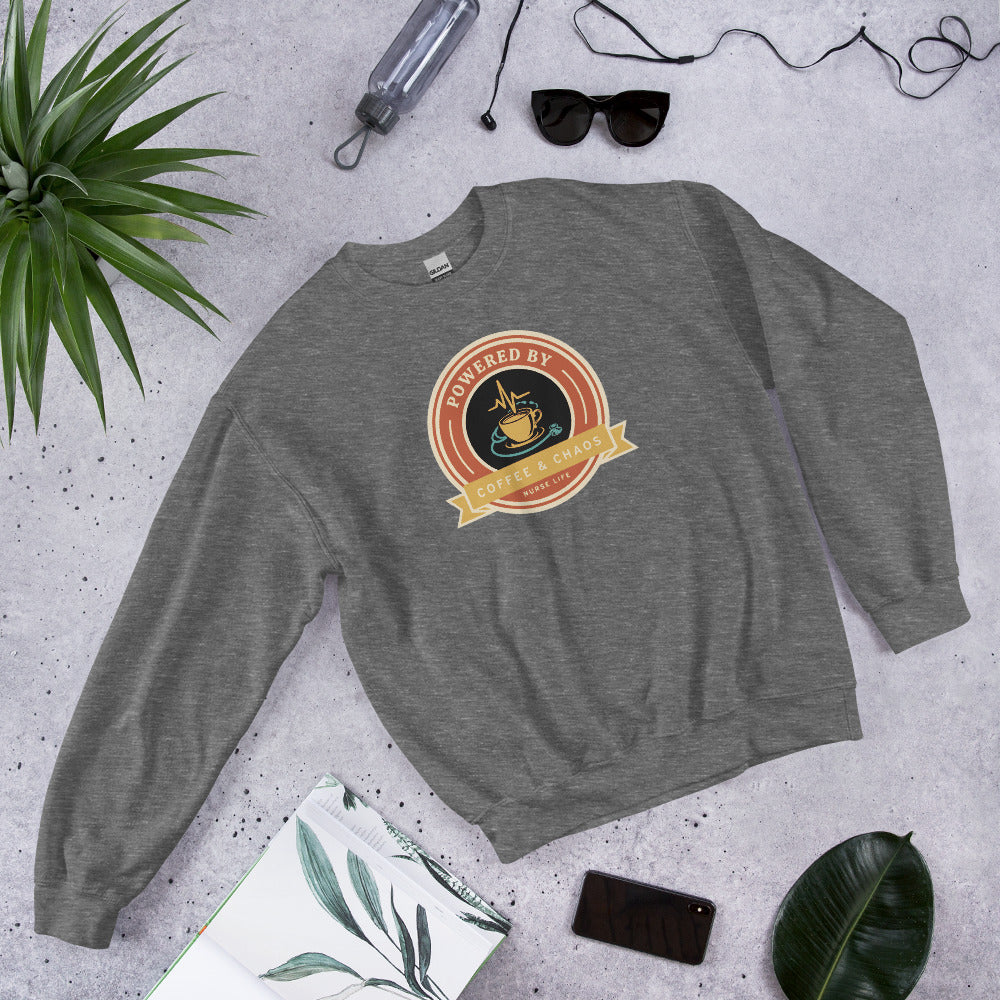 Powered by Coffee & Chaos retro nurse badge crewneck sweatshirt — Graphite Heather, front-right