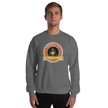 Powered by Coffee & Chaos retro nurse badge crewneck sweatshirt — Graphite Heather, on model