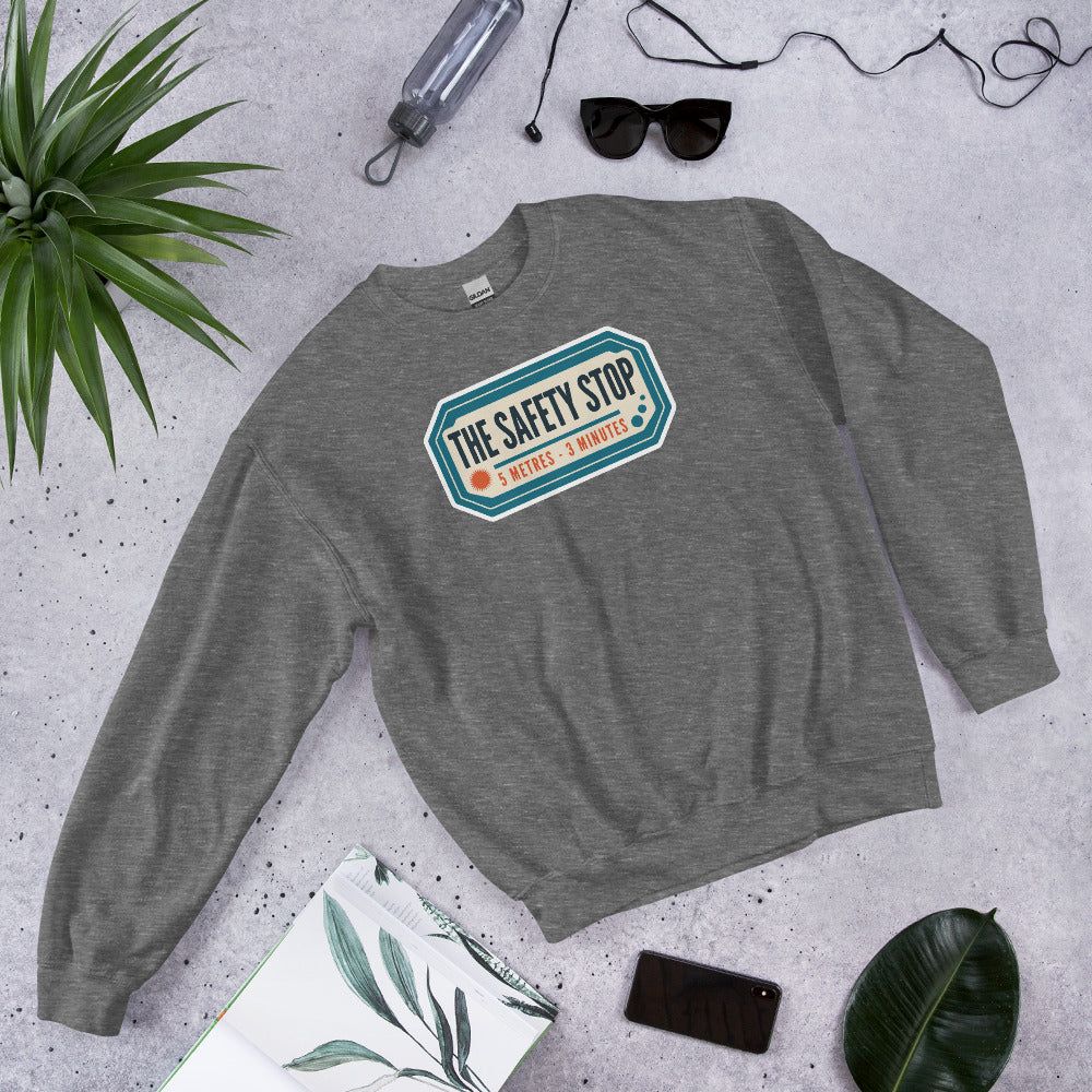 The Safety Stop vintage scuba diving travel decal sweatshirt — Graphite Heather, flat lay