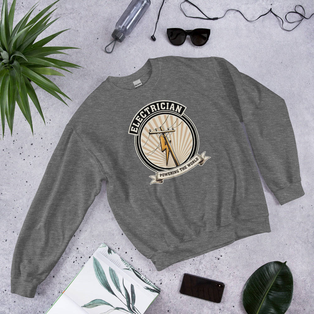 Powering The World electrician emblem crewneck — Graphite Heather, flat lay