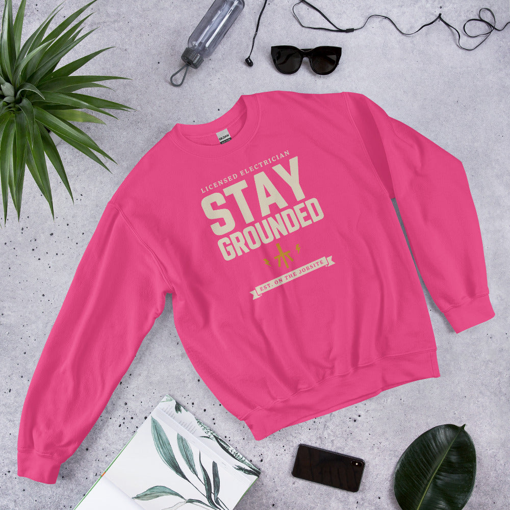 Stay Grounded funny electrician crewneck — Heliconia, flat lay