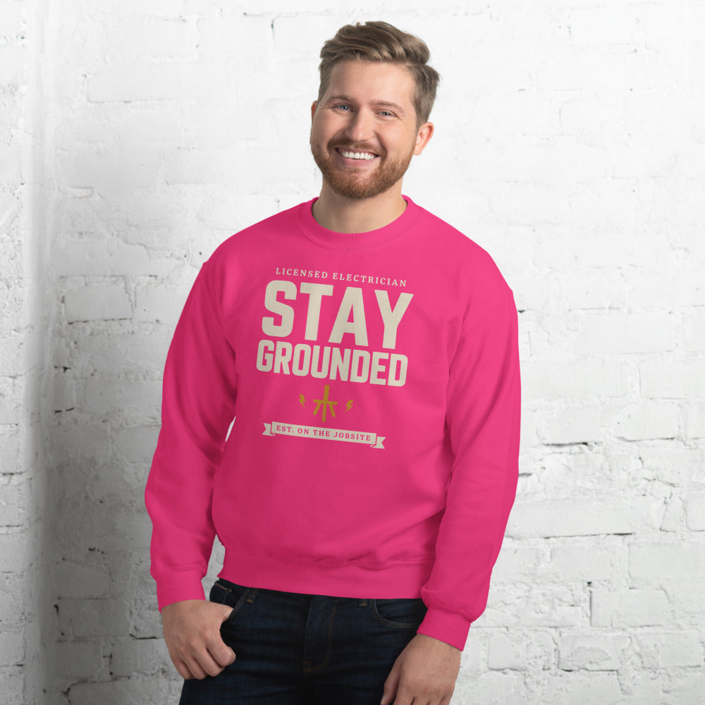 Stay Grounded funny electrician crewneck — Heliconia, on model