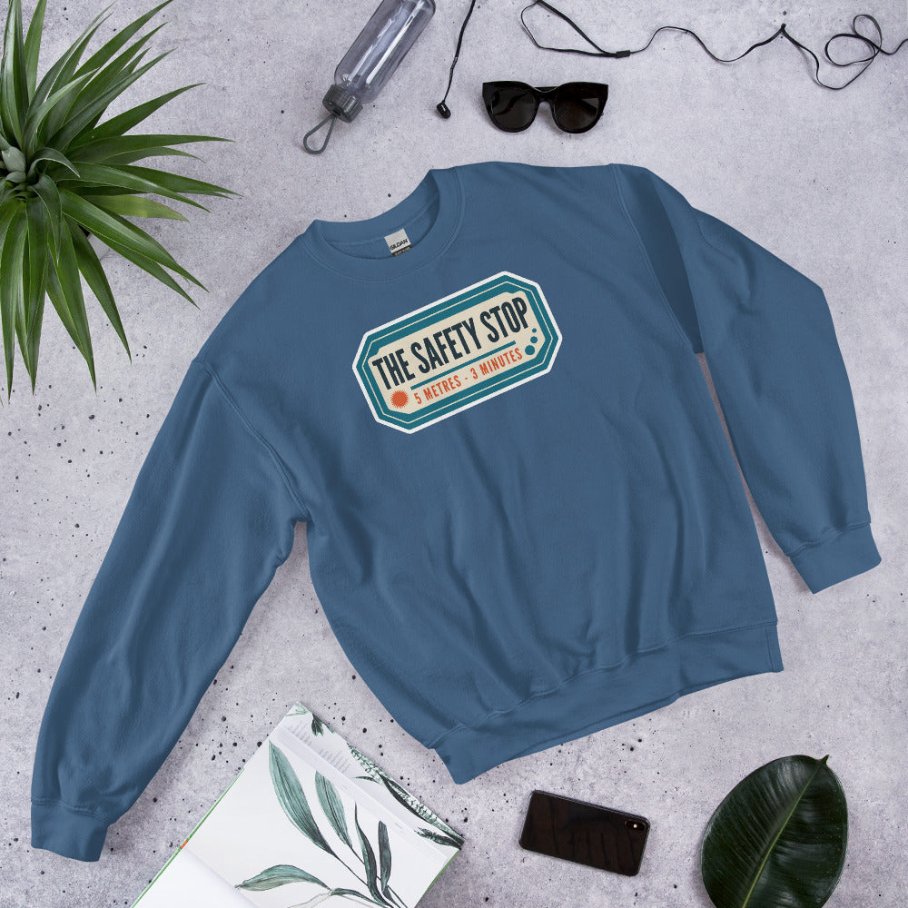 The Safety Stop vintage scuba diving travel decal sweatshirt — Indigo Blue, flat lay