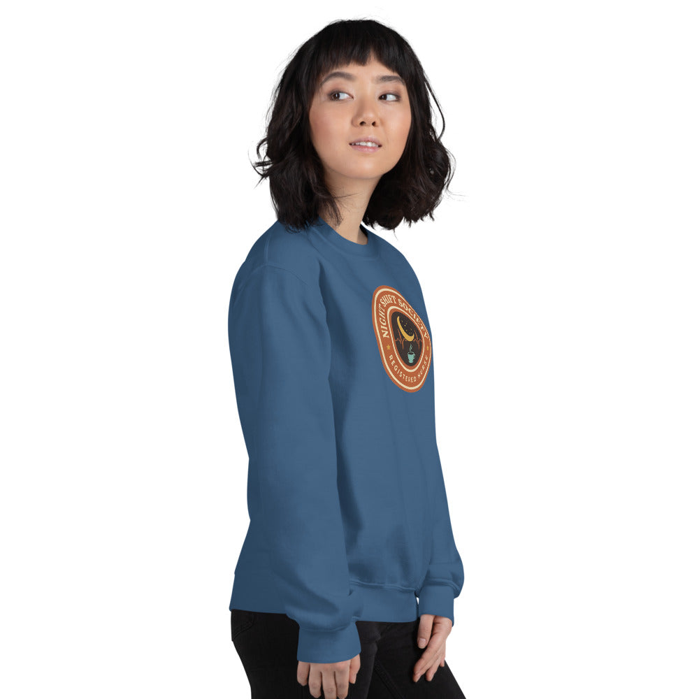 Night Shift Society retro registered nurse badge crewneck sweatshirt — Indigo Blue, on model