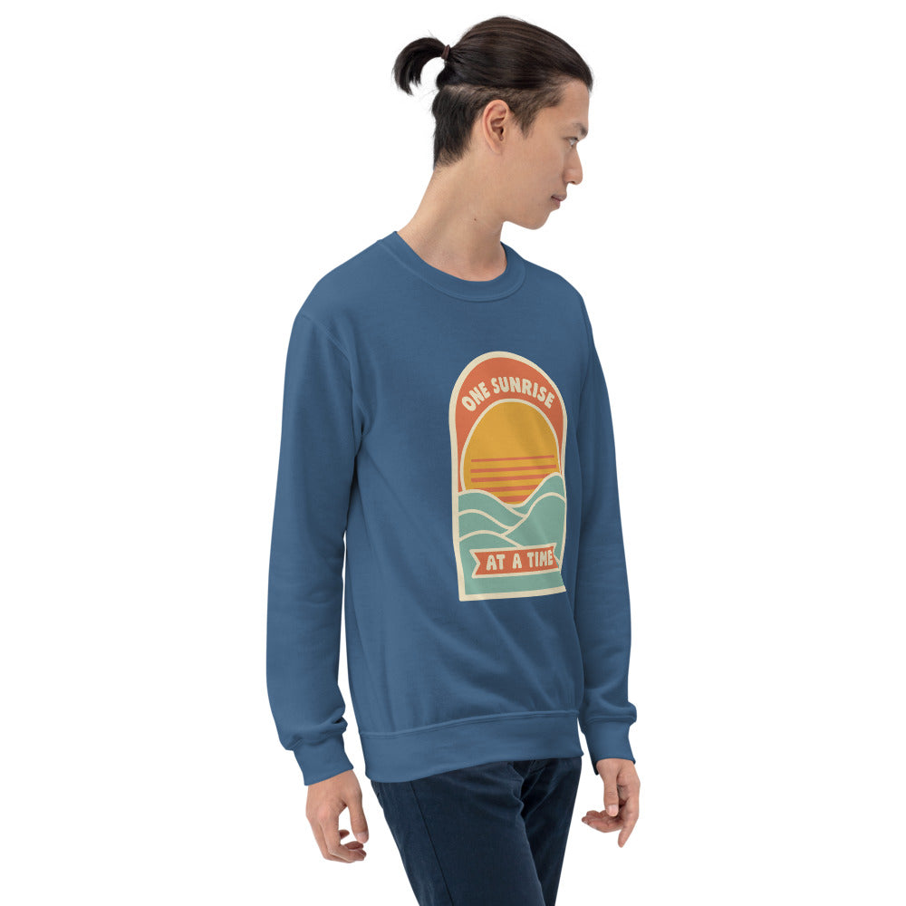 One Sunrise at a Time retro sunrise crewneck sweatshirt — Indigo Blue, on model