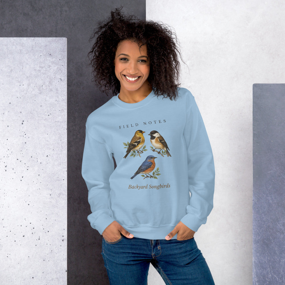 Backyard Songbirds vintage field-guide crewneck sweatshirt — Light Blue, on model