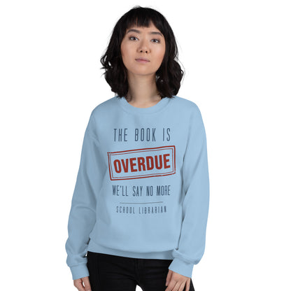The Book Is Overdue funny school librarian crewneck sweatshirt — Light Blue, on model