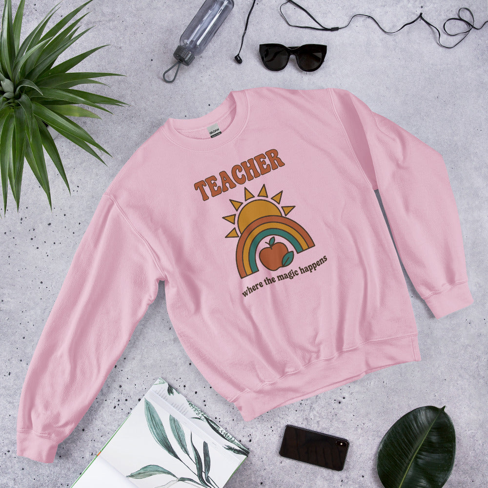 Teacher Where The Magic Happens retro groovy teacher crewneck sweatshirt — Light Pink, front angle