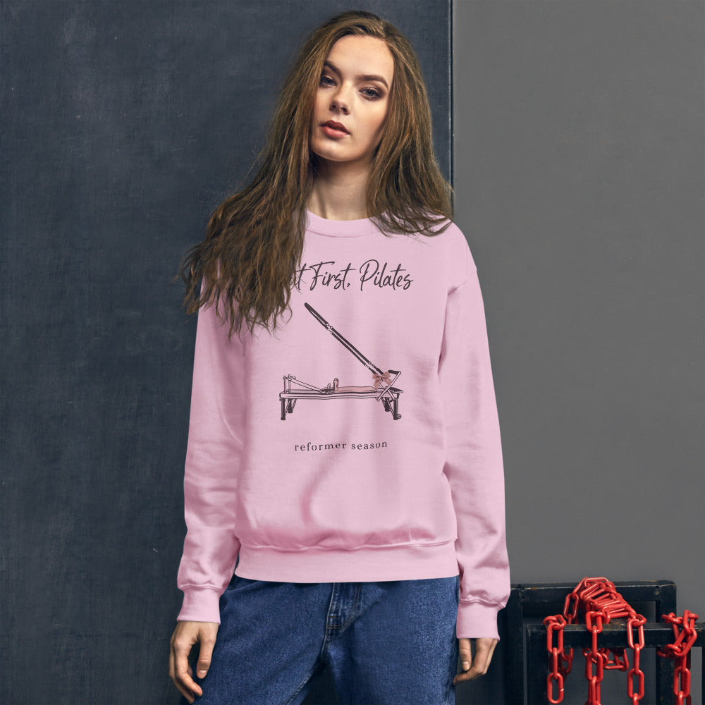 But First Pilates reformer line-art crewneck sweatshirt — Light Pink, on model