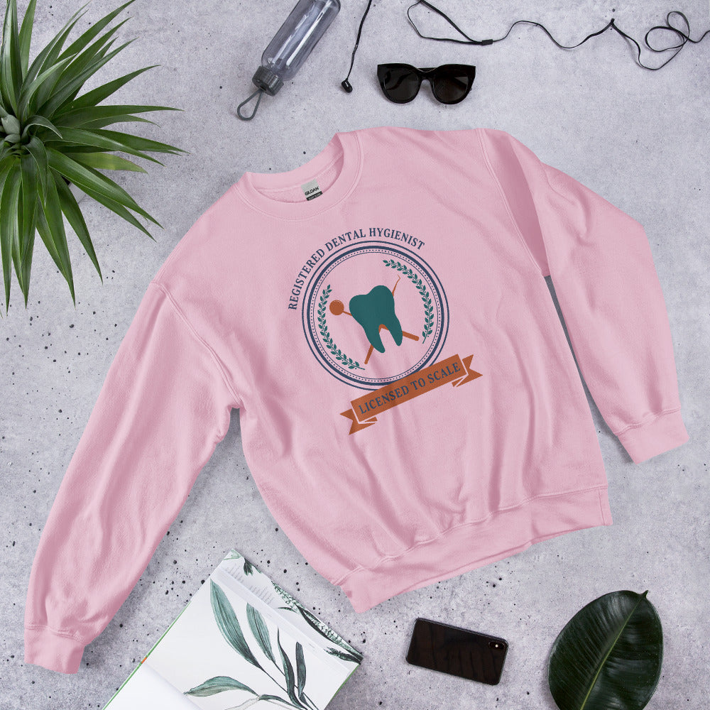 Licensed to Scale registered dental hygienist crewneck sweatshirt — Light Pink, front-right