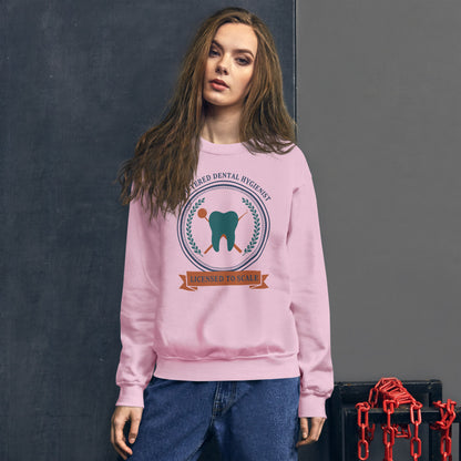 Licensed to Scale registered dental hygienist crewneck sweatshirt — Light Pink, on model