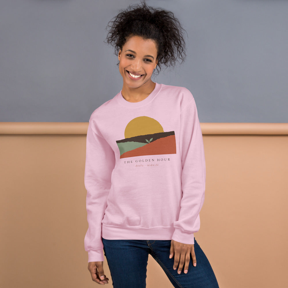 The Golden Hour birth worker crewneck sweatshirt — Light Pink, on model