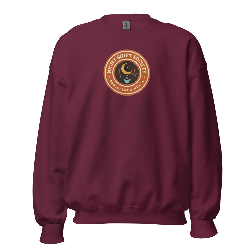 Night Shift Society retro registered nurse badge crewneck sweatshirt — Maroon, front