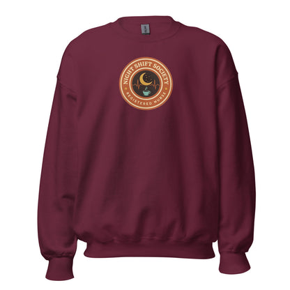 Night Shift Society retro registered nurse badge crewneck sweatshirt — Maroon, front