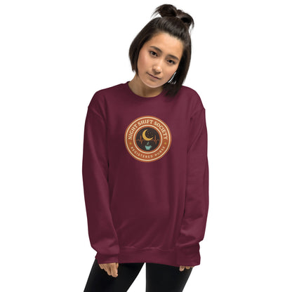 Night Shift Society retro registered nurse badge crewneck sweatshirt — Maroon, on model