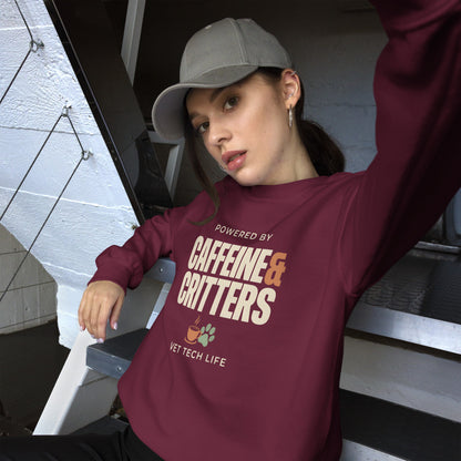 Powered by Caffeine & Critters funny vet tech crewneck sweatshirt — Maroon, on model