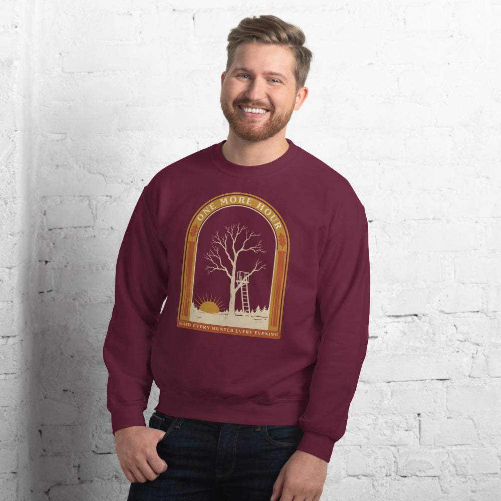 One More Hour funny deer hunting crewneck — Maroon, on model