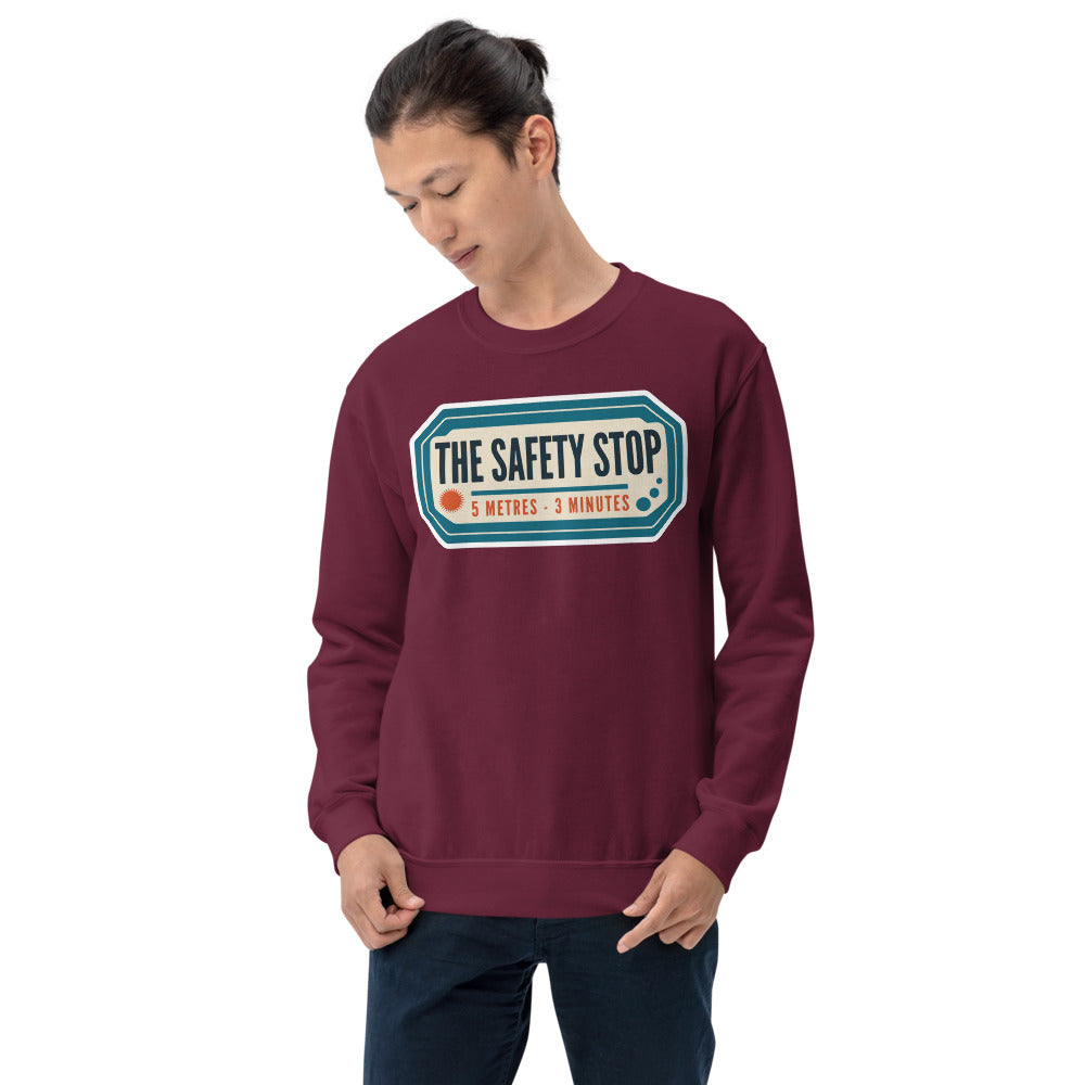 The Safety Stop vintage scuba diving travel decal sweatshirt — Maroon, on model