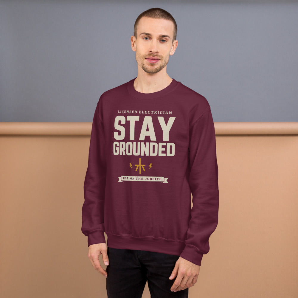 Stay Grounded funny electrician crewneck — Maroon, on model