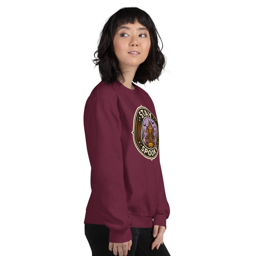 Stay Spooky retro Halloween vintage badge crewneck sweatshirt — Maroon, on model