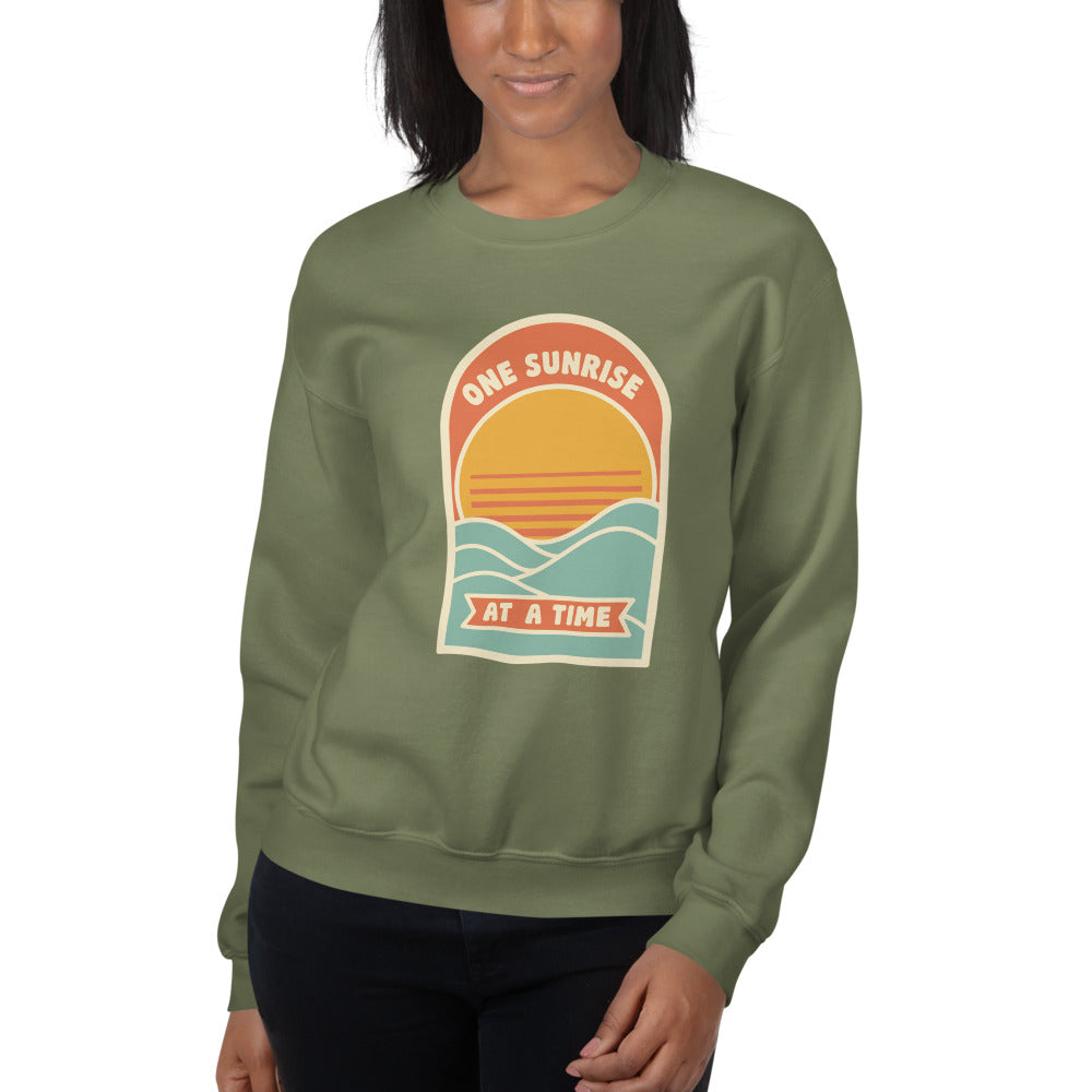 One Sunrise at a Time retro sunrise crewneck sweatshirt — Military Green, on model