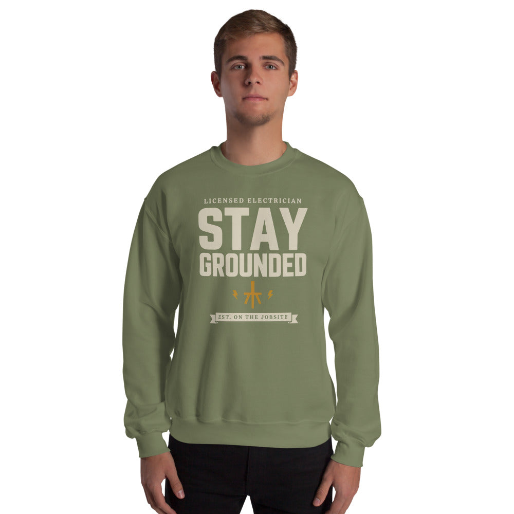 Stay Grounded funny electrician crewneck — Military Green, on model