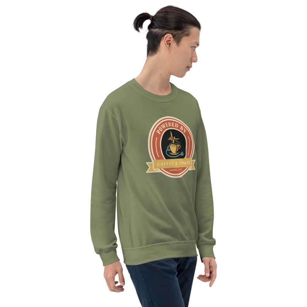 Powered by Coffee & Chaos retro nurse badge crewneck sweatshirt — Military Green, on model
