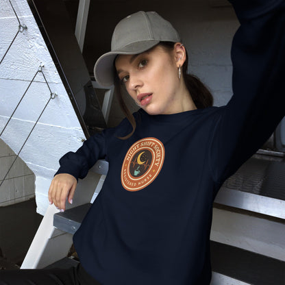 Night Shift Society retro registered nurse badge crewneck sweatshirt — Navy, on model