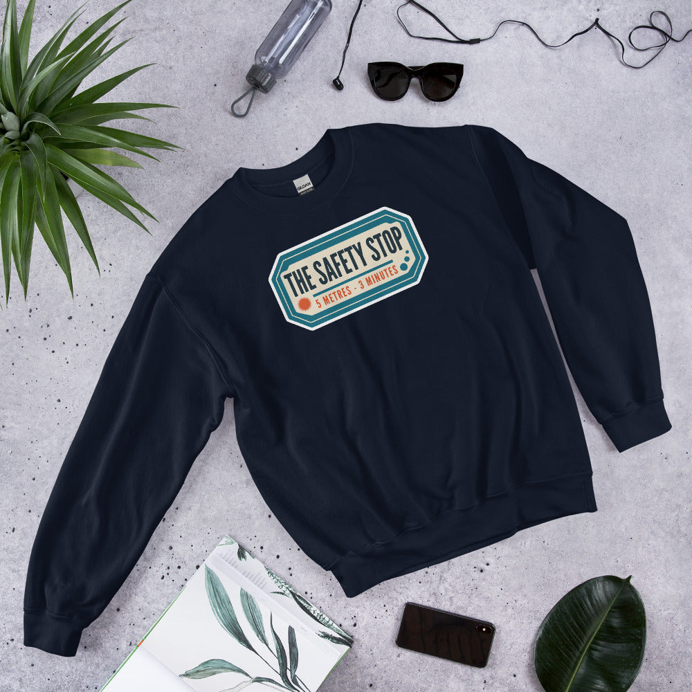 The Safety Stop vintage scuba diving travel decal sweatshirt — Navy, flat lay