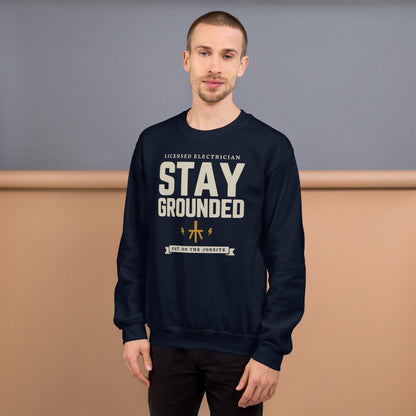 Stay Grounded funny electrician crewneck — Navy, on model