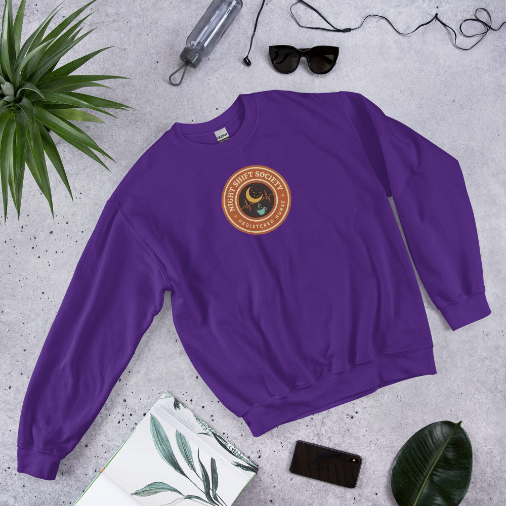 Night Shift Society retro registered nurse badge crewneck sweatshirt — Purple, front-right