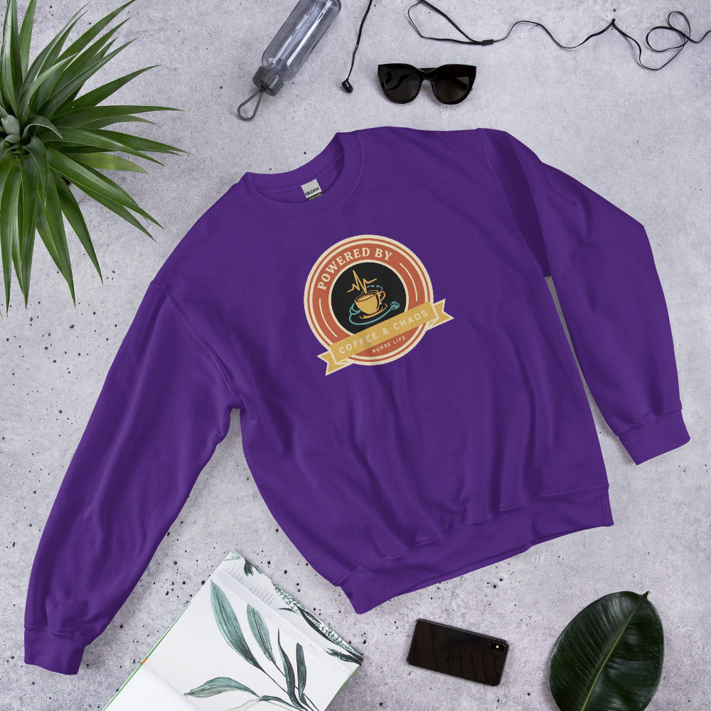 Powered by Coffee & Chaos retro nurse badge crewneck sweatshirt — Purple, front-right