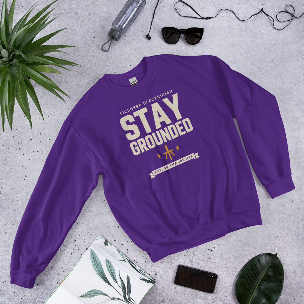Stay Grounded funny electrician crewneck — Purple, flat lay