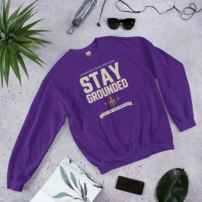 Stay Grounded funny electrician crewneck — Purple, flat lay