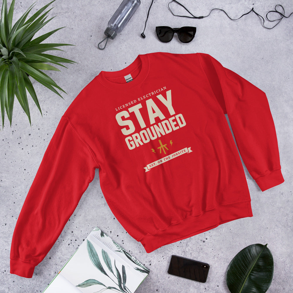 Stay Grounded funny electrician crewneck — Red, flat lay