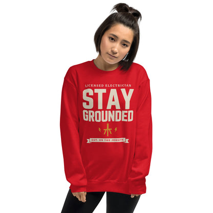Stay Grounded funny electrician crewneck — Red, on model