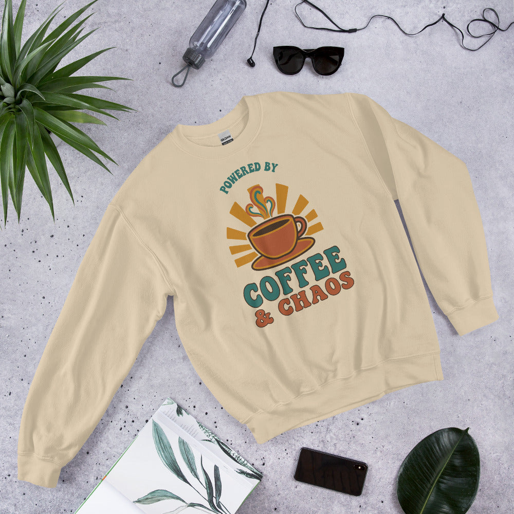 Powered By Coffee And Chaos retro groovy teacher crewneck sweatshirt — Sand, front view