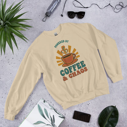 Powered By Coffee And Chaos retro groovy teacher crewneck sweatshirt — Sand, front view