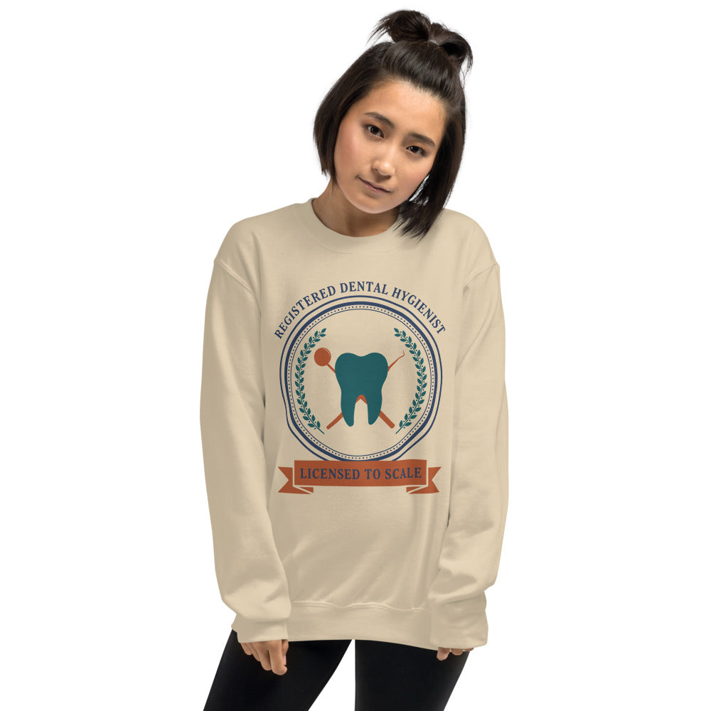 Licensed to Scale registered dental hygienist crewneck sweatshirt — Sand, on model