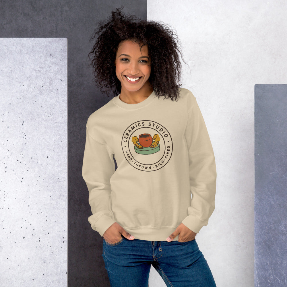 Ceramics Studio Badge hand-thrown pottery crewneck sweatshirt — Sand, on model