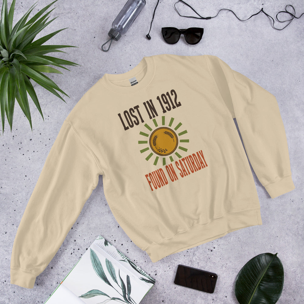 Lost in 1912 Found on Saturday retro metal detecting crewneck sweatshirt — Sand, flat lay