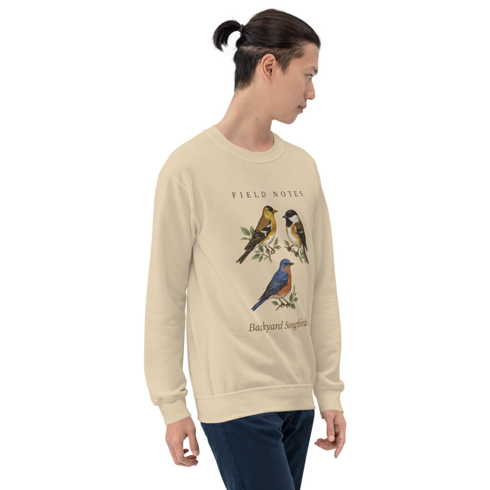 Backyard Songbirds vintage field-guide crewneck sweatshirt — Sand, on model