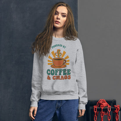 Model wearing Powered By Coffee And Chaos retro groovy teacher crewneck sweatshirt — Sport Grey