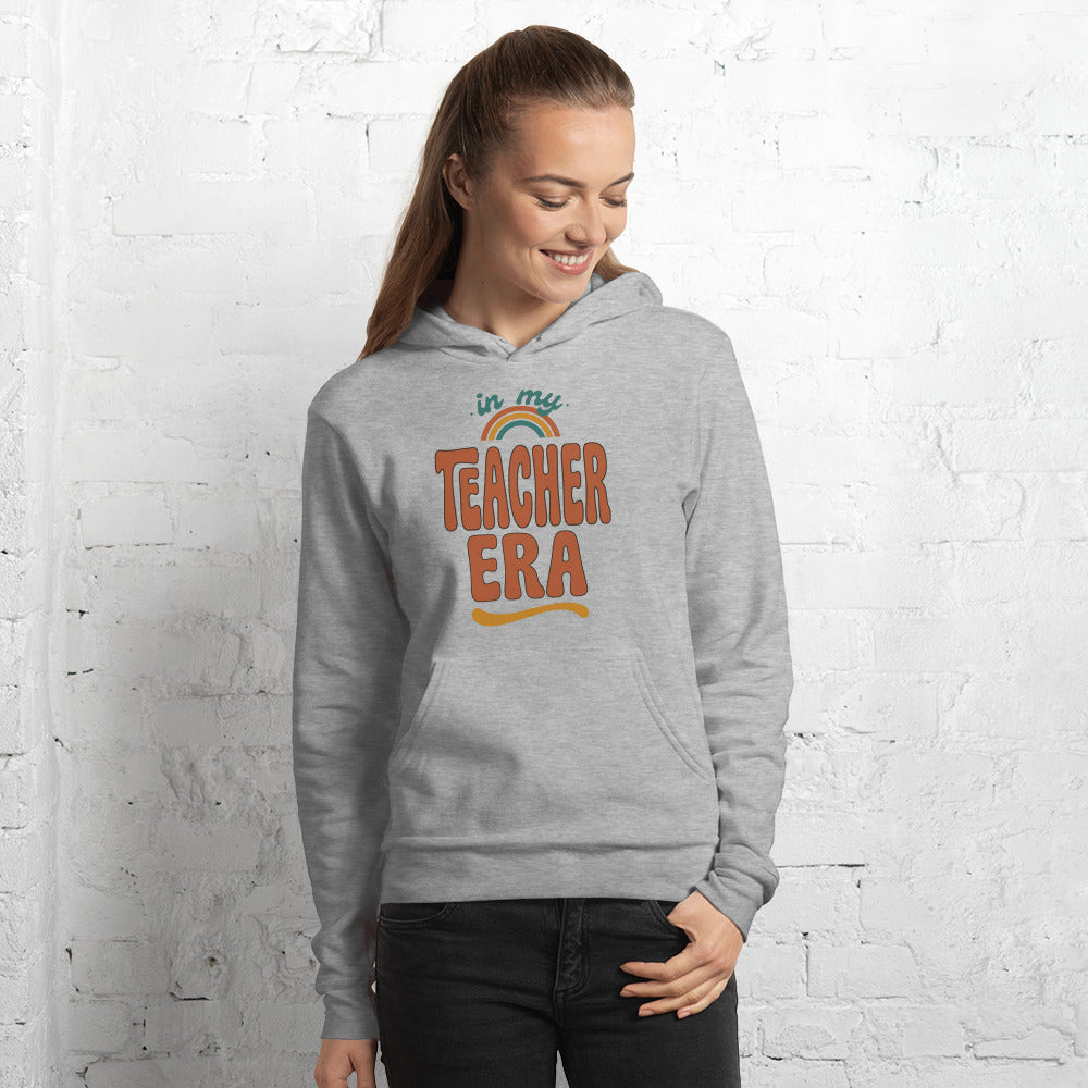 In My Teacher Era retro groovy teacher hoodie — Athletic Heather, on model