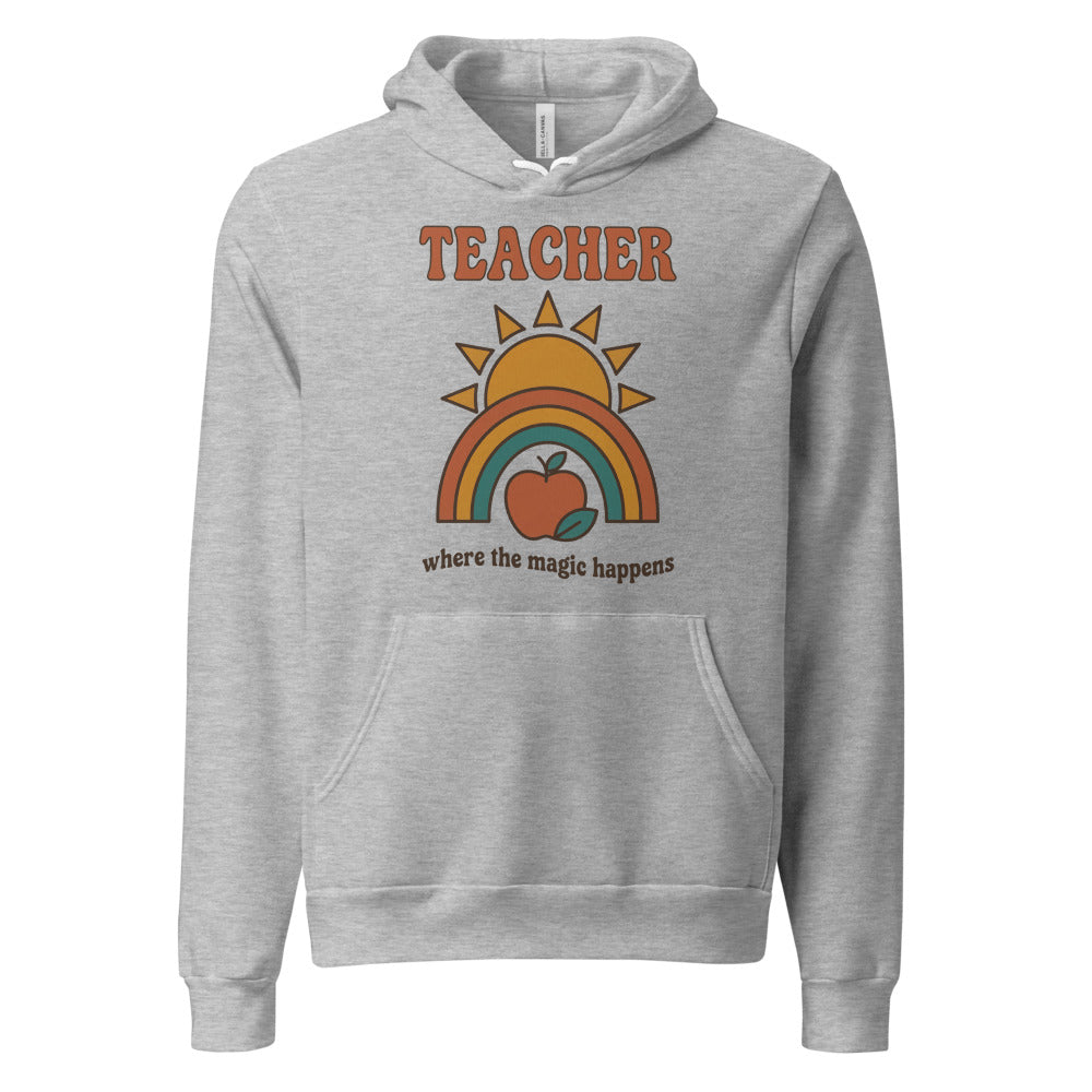 Teacher Where The Magic Happens retro groovy teacher hoodie — Athletic Heather, front