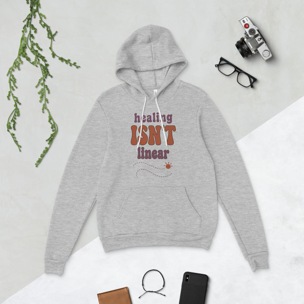 Healing Isn't Linear soft retro mental health hoodie — Athletic Heather, flat lay