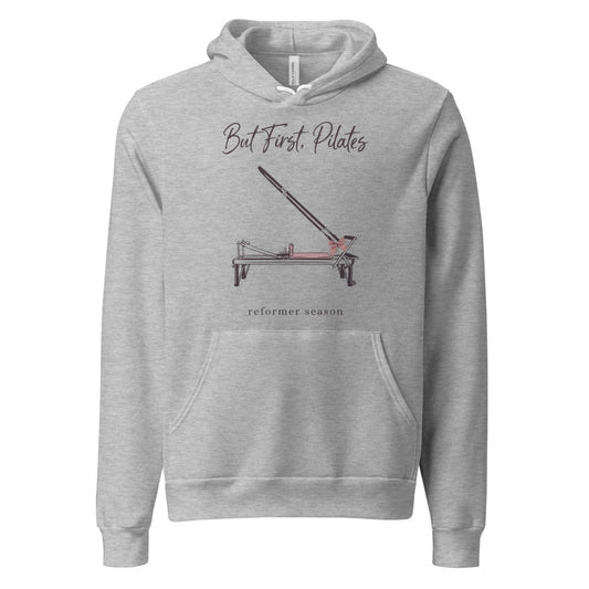 But First Pilates reformer line-art hoodie — Athletic Heather, front