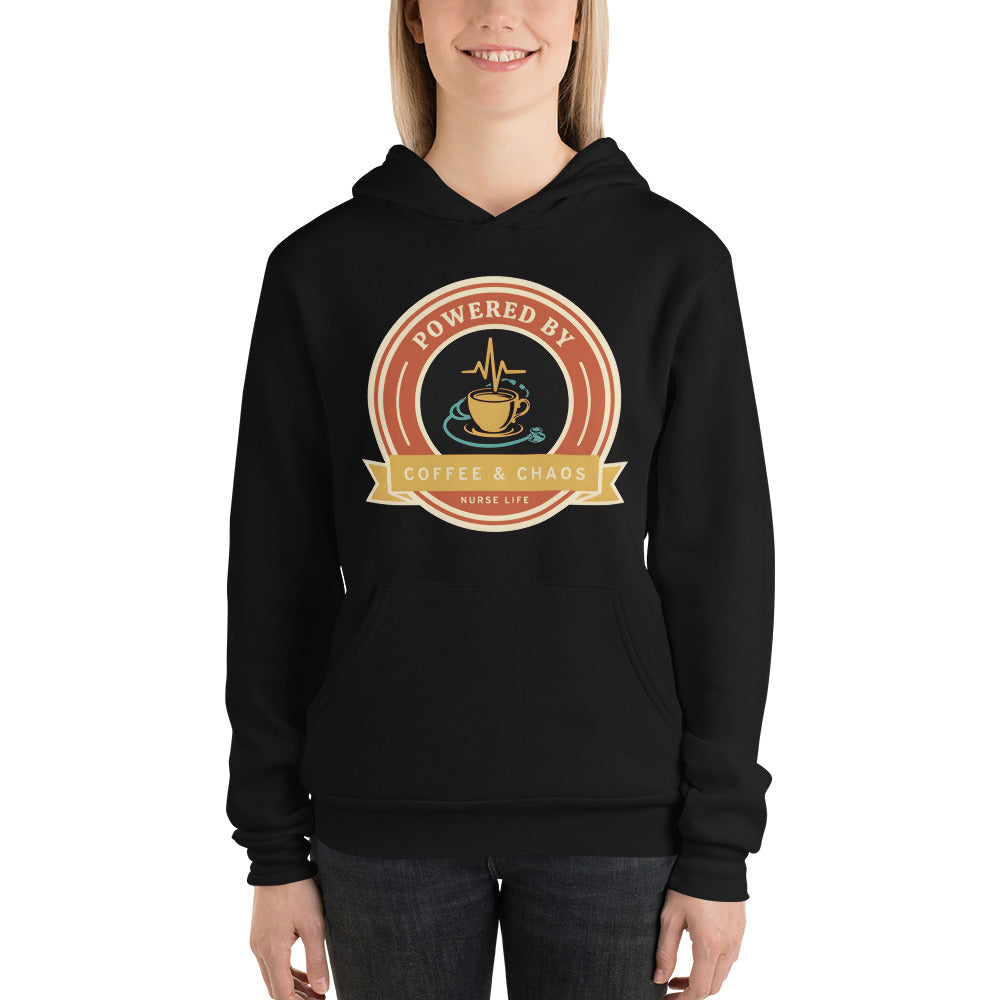 Powered by Coffee & Chaos retro nurse badge hoodie — Black, on model