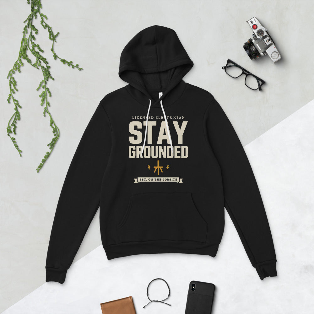 Stay Grounded funny electrician hoodie — Black, flat lay
